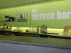 “The terraced bar” text, one of the 50 or so self adhesive vinyl graphics applied directly to painted walls around the centre. An extremely cost effective way of designating different areas in a larger building.